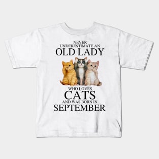 Never Underestimate An Old Lady Who Loves Cats September Kids T-Shirt